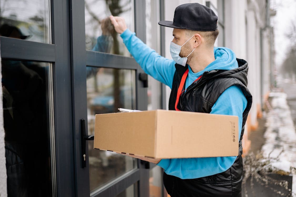 Courier collecting a sealed parcel from a Sydney business