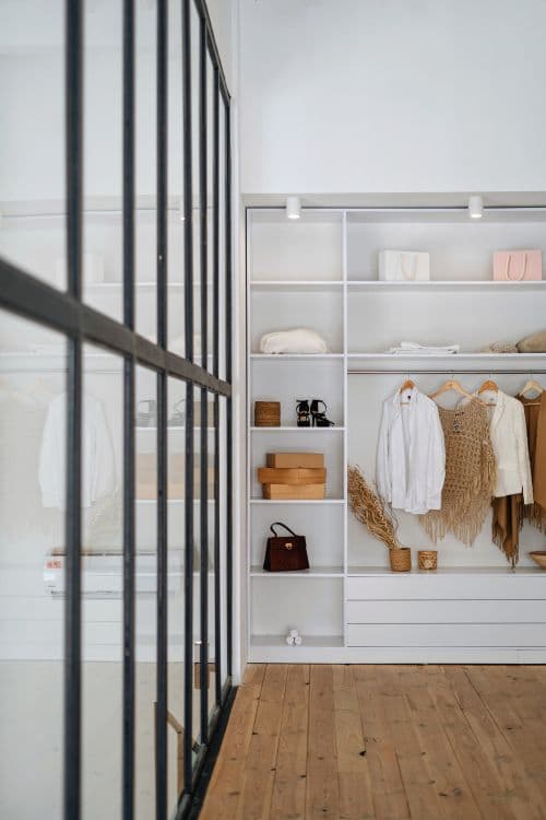 Minimalist wardrobe with neatly organised clothing