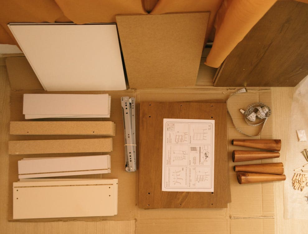 Flat pack furniture parts and instruction manual laid out