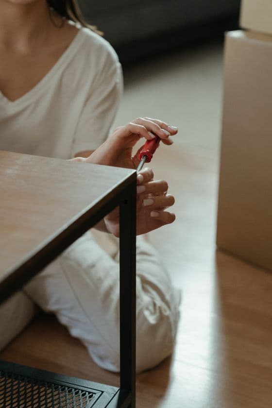 Professional assembling furniture with a screwdriver