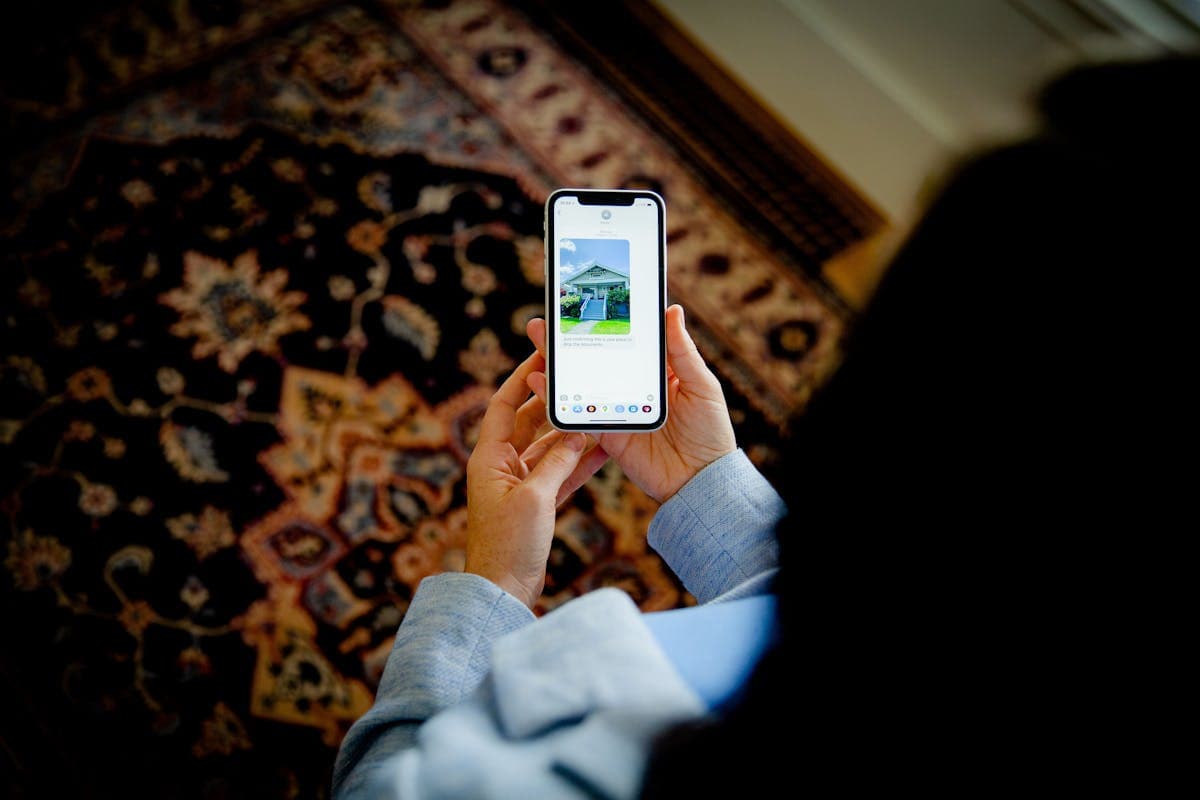Person using phone to request home setup service