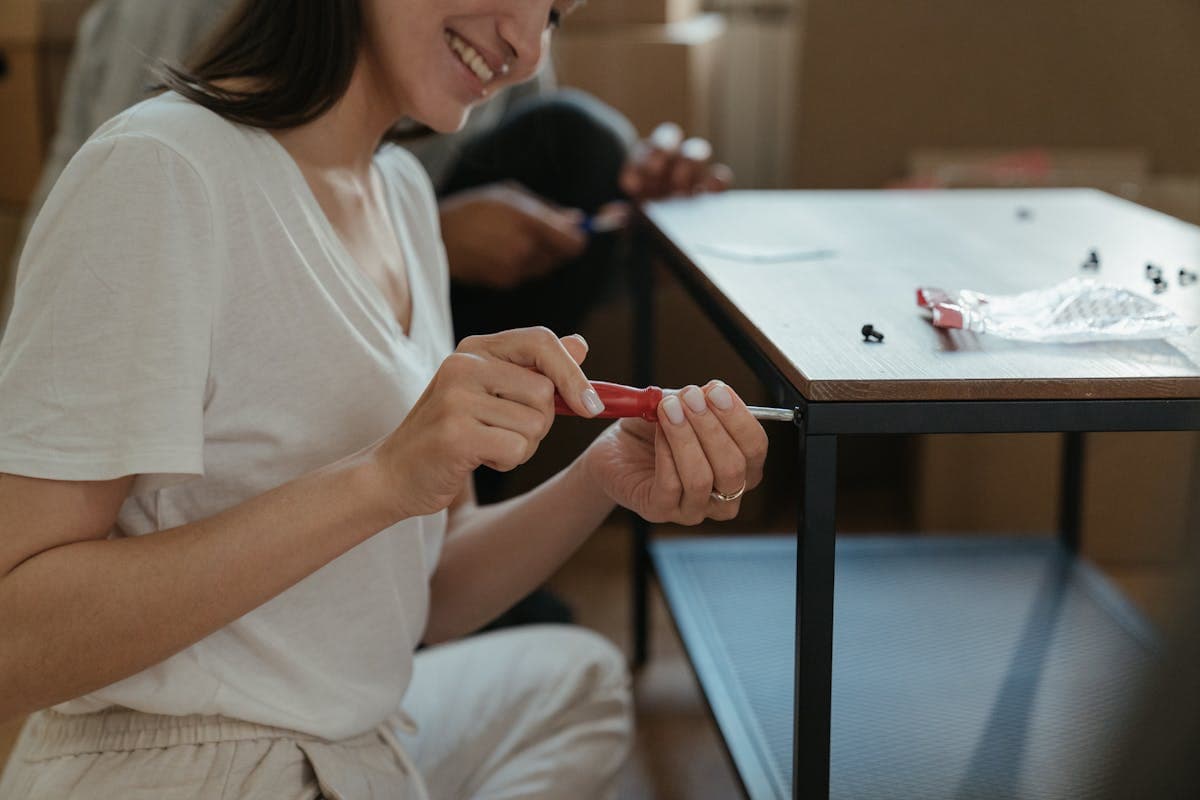 Woman assembling furniture during home setup