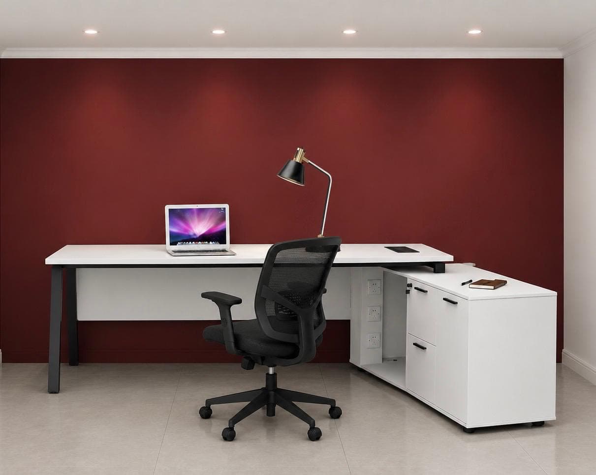 White L-shaped executive desk with black A-frame legs and a matching return unit with drawers and a cupboard